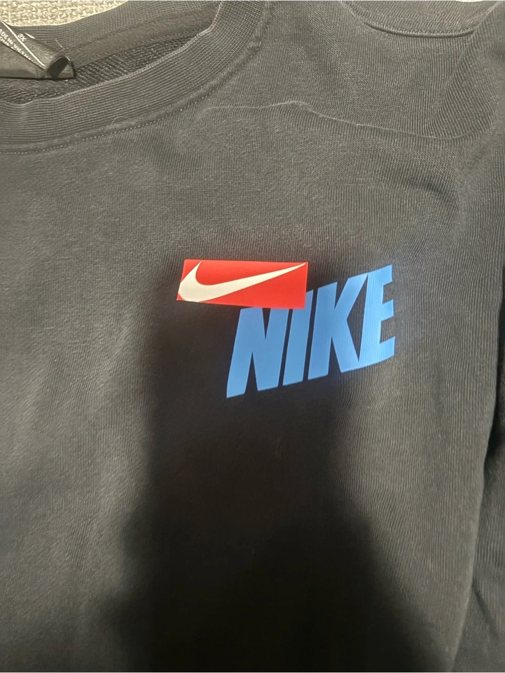 Nike Black Crewneck Sweatshirt with Red Sleeve Panels and Blue Logo